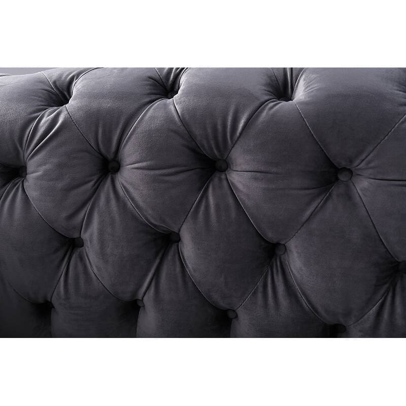 Divano ad angolo in velluto blu scuro schiacciato da salotto